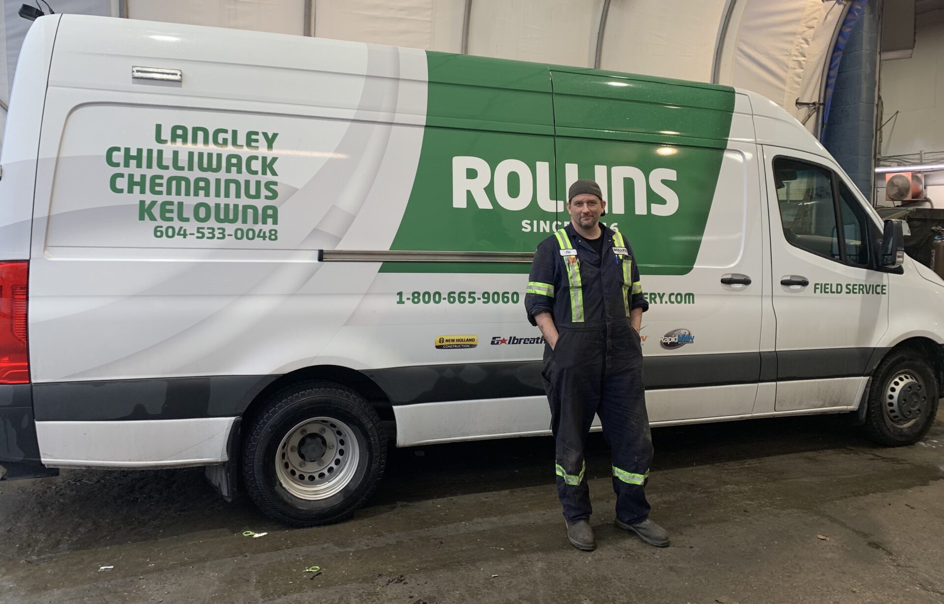 Mechanic standing in front of Field Service Truck