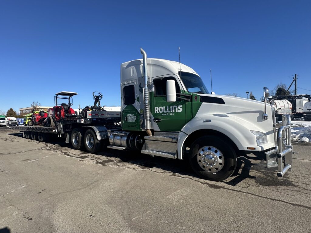 Rollins semi truck with mower riding