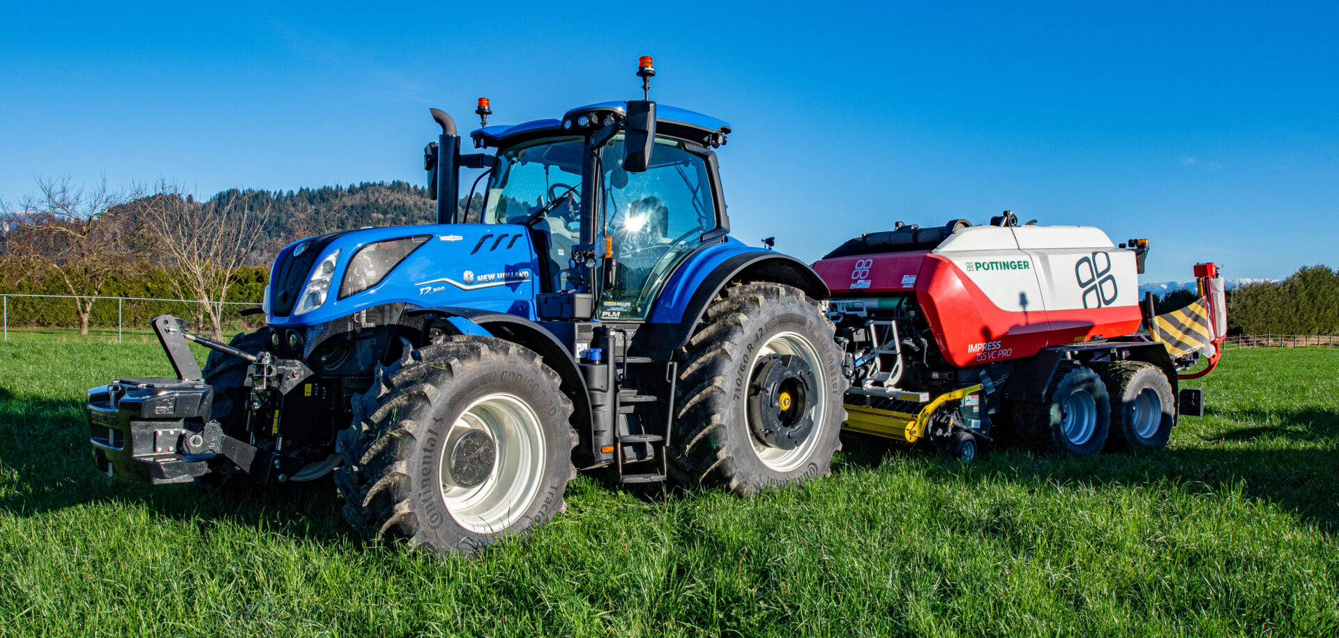 New Holland tractor with Pottinger baler on BC farm